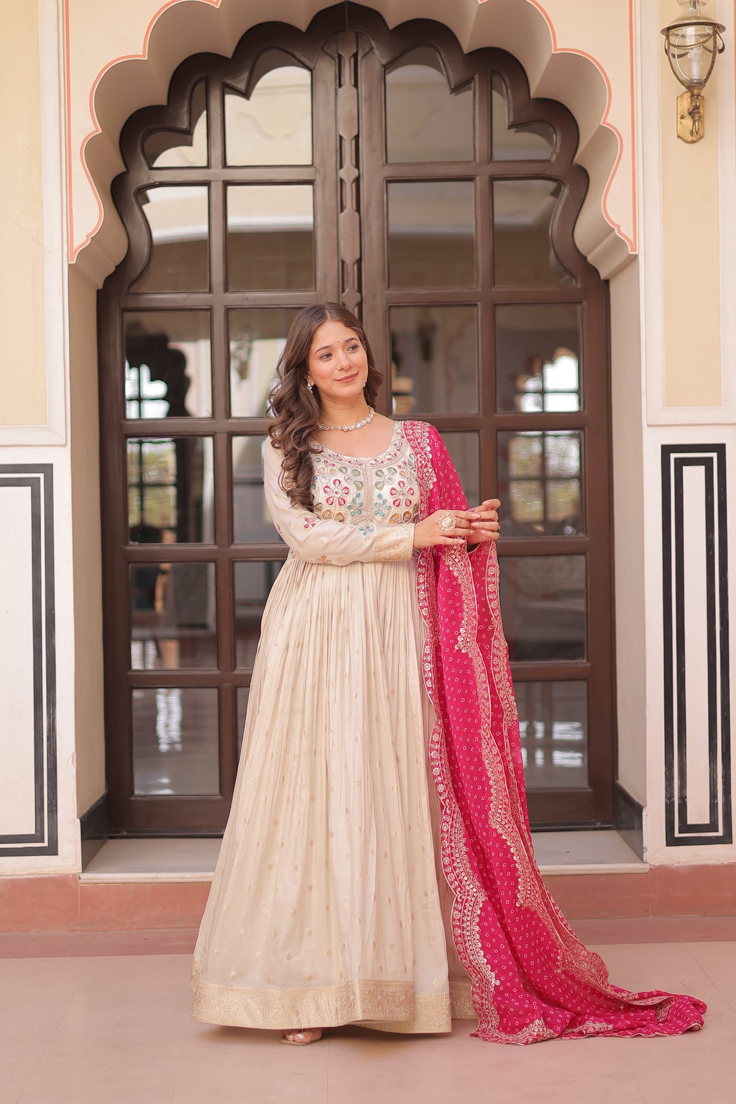 *Experience the allure of Trending Cosmos Jequard Gown With Bandhani Printed Embroidered Cut work Dupatta. Discover the perfect fusion of elegance and grace. Shop now for a timeless appearance.*
