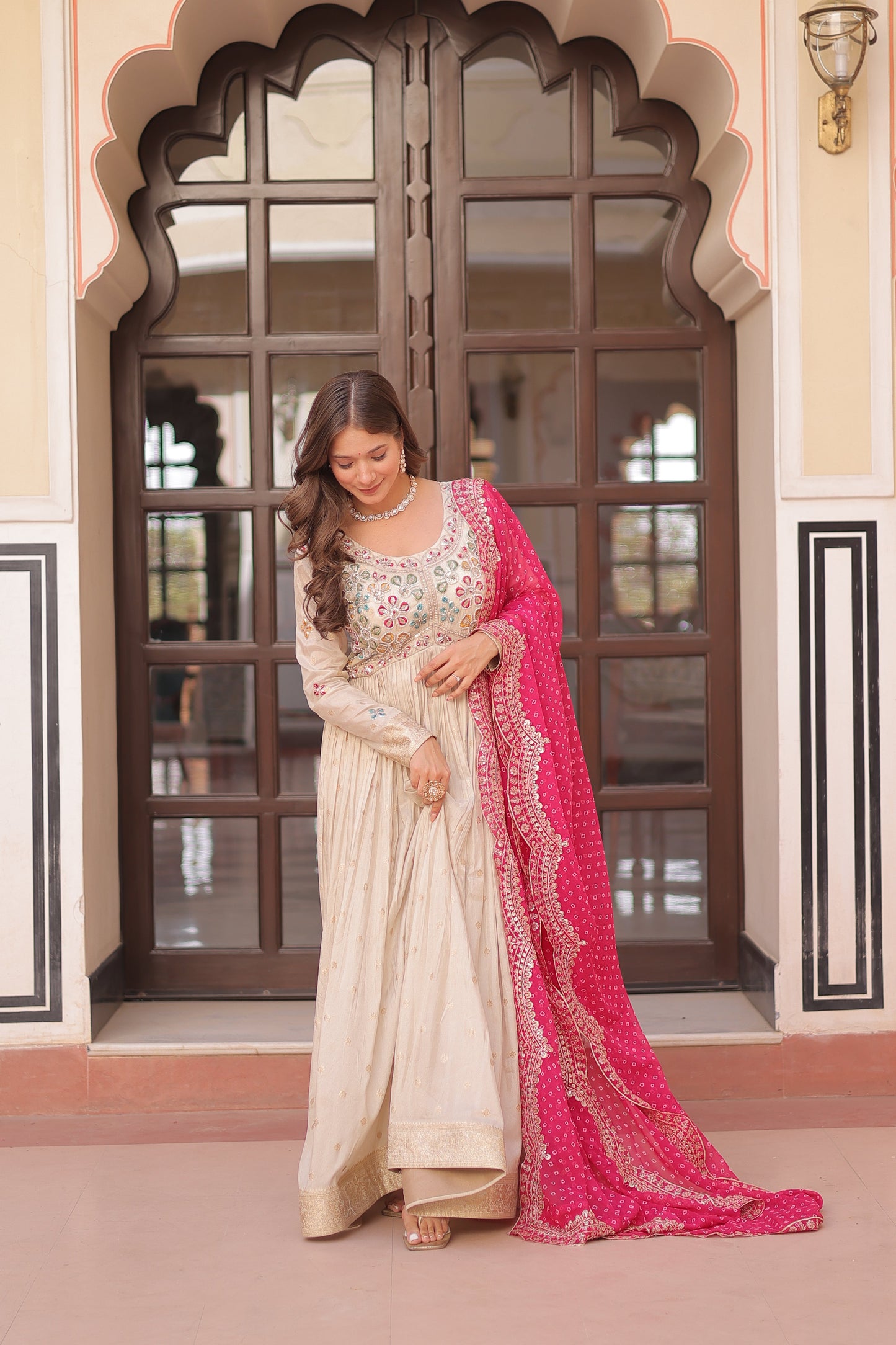 *Experience the allure of Trending Cosmos Jequard Gown With Bandhani Printed Embroidered Cut work Dupatta. Discover the perfect fusion of elegance and grace. Shop now for a timeless appearance.*