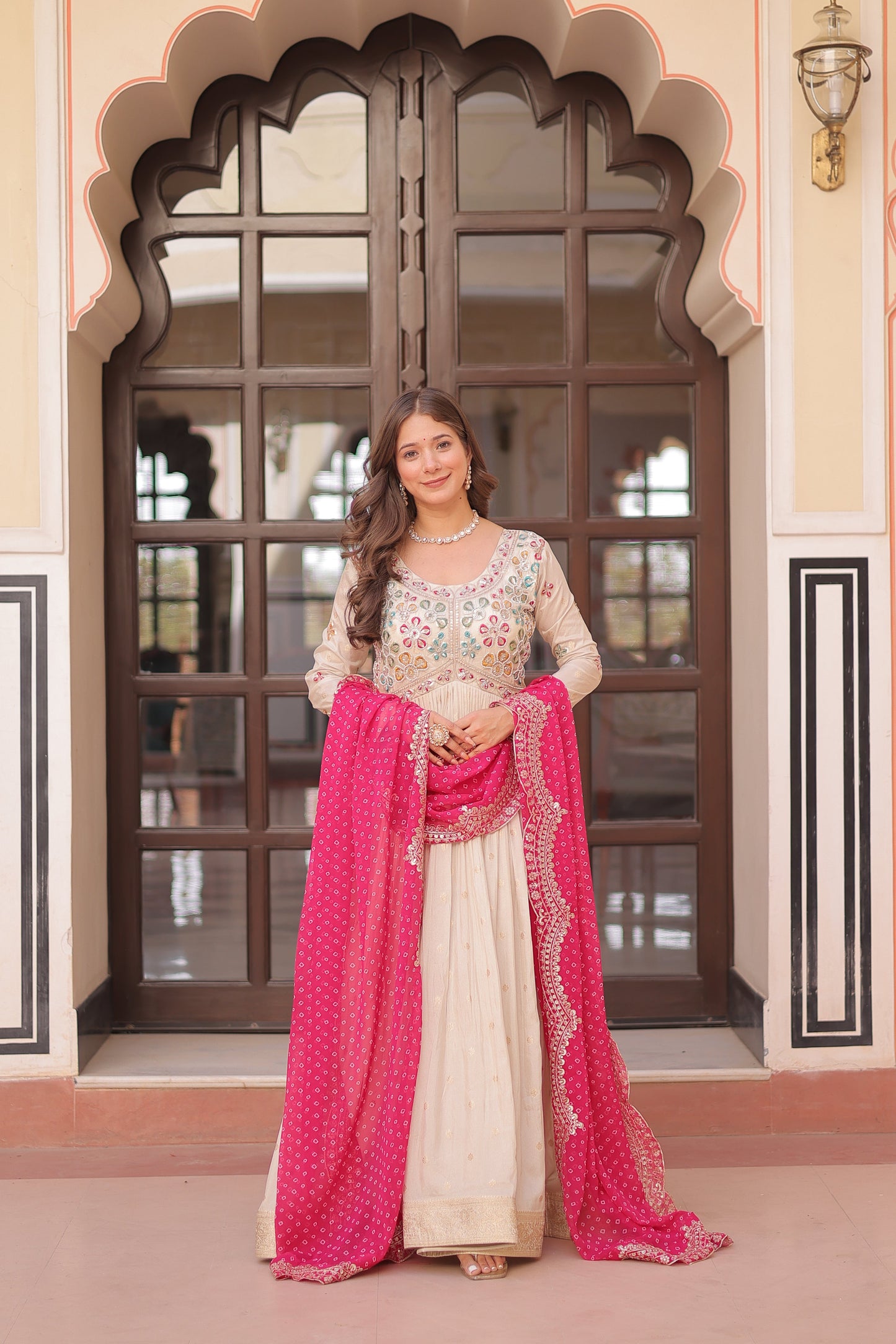 *Experience the allure of Trending Cosmos Jequard Gown With Bandhani Printed Embroidered Cut work Dupatta. Discover the perfect fusion of elegance and grace. Shop now for a timeless appearance.*