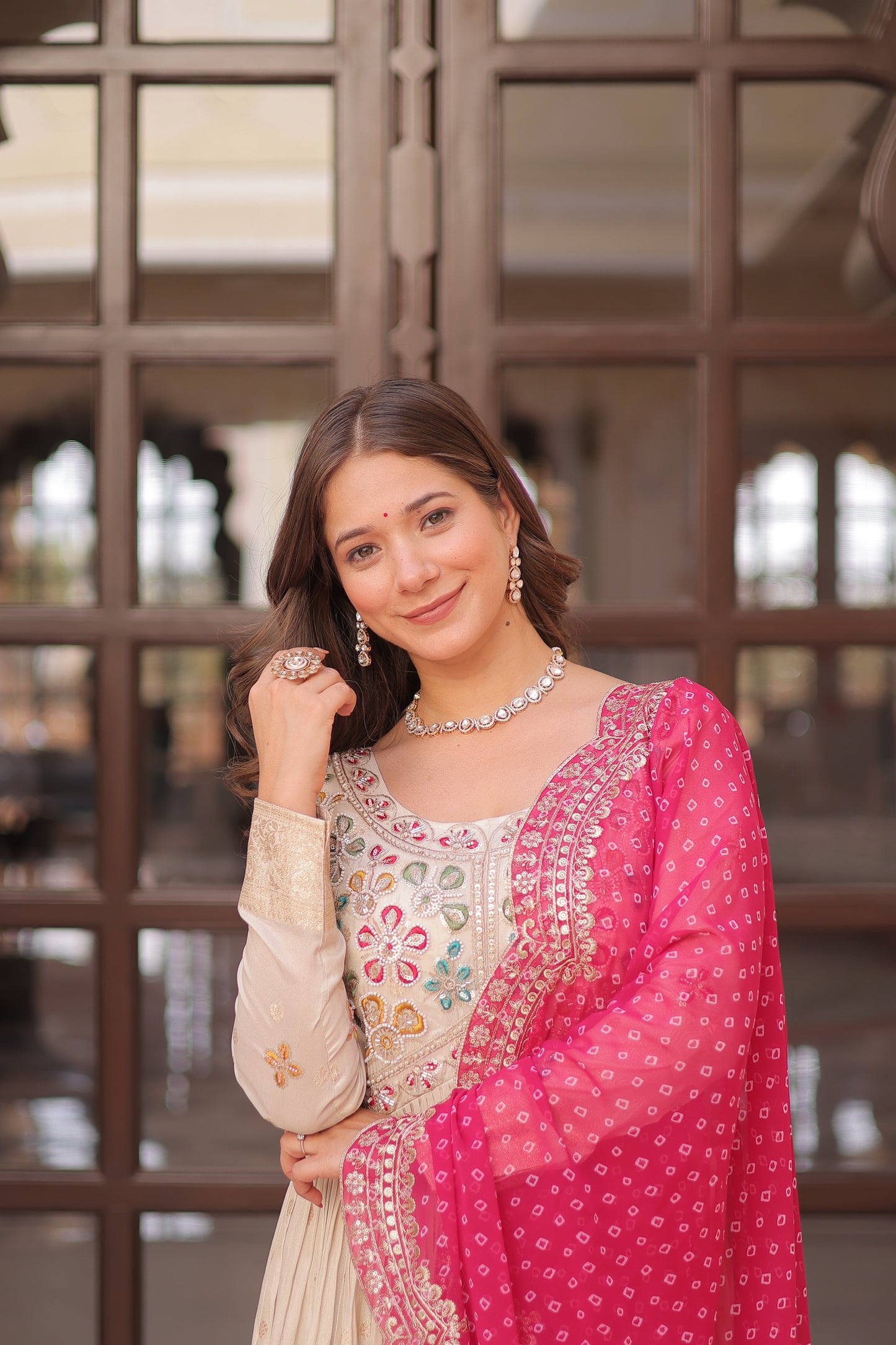 *Experience the allure of Trending Cosmos Jequard Gown With Bandhani Printed Embroidered Cut work Dupatta. Discover the perfect fusion of elegance and grace. Shop now for a timeless appearance.*