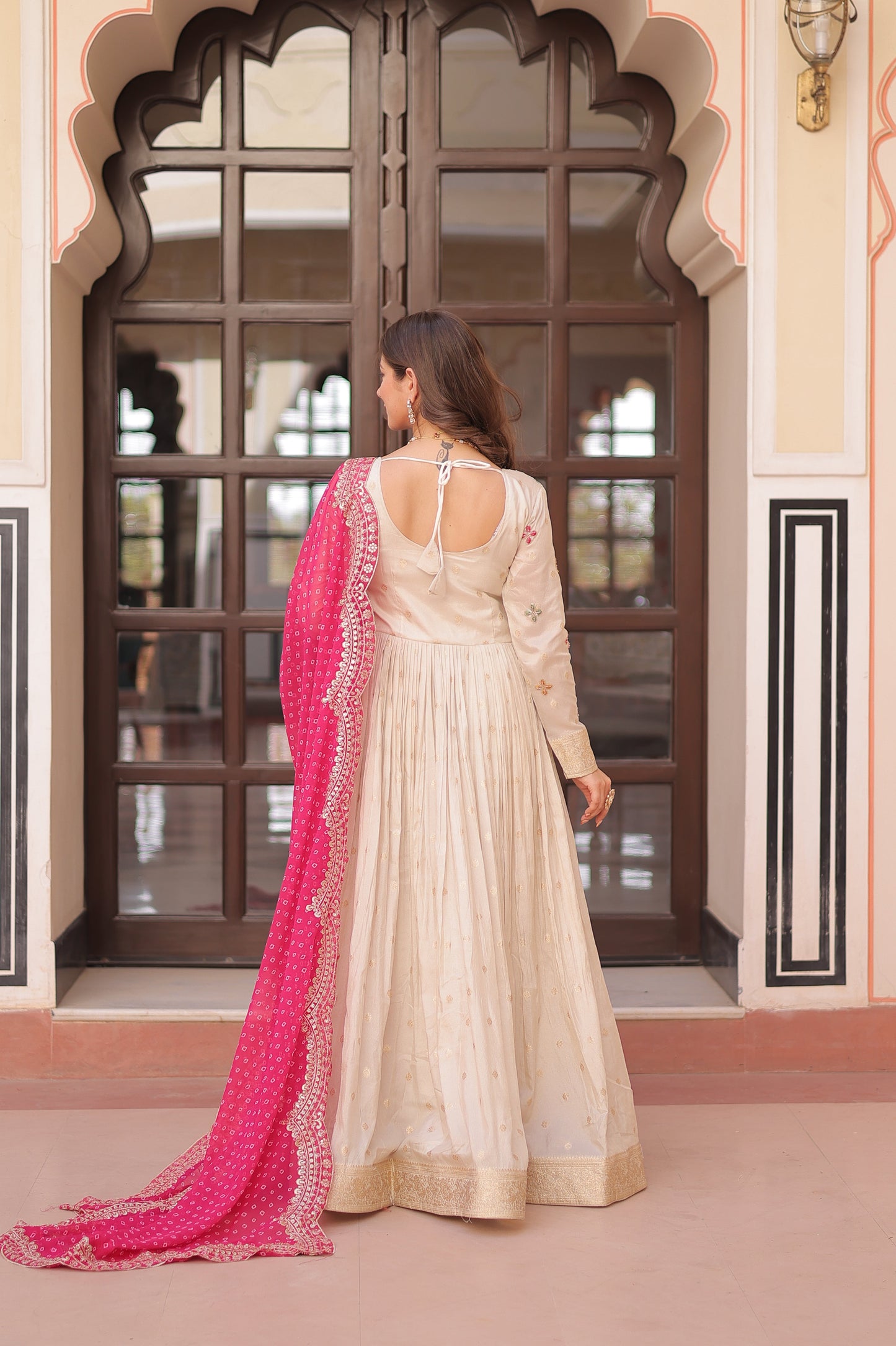 *Experience the allure of Trending Cosmos Jequard Gown With Bandhani Printed Embroidered Cut work Dupatta. Discover the perfect fusion of elegance and grace. Shop now for a timeless appearance.*