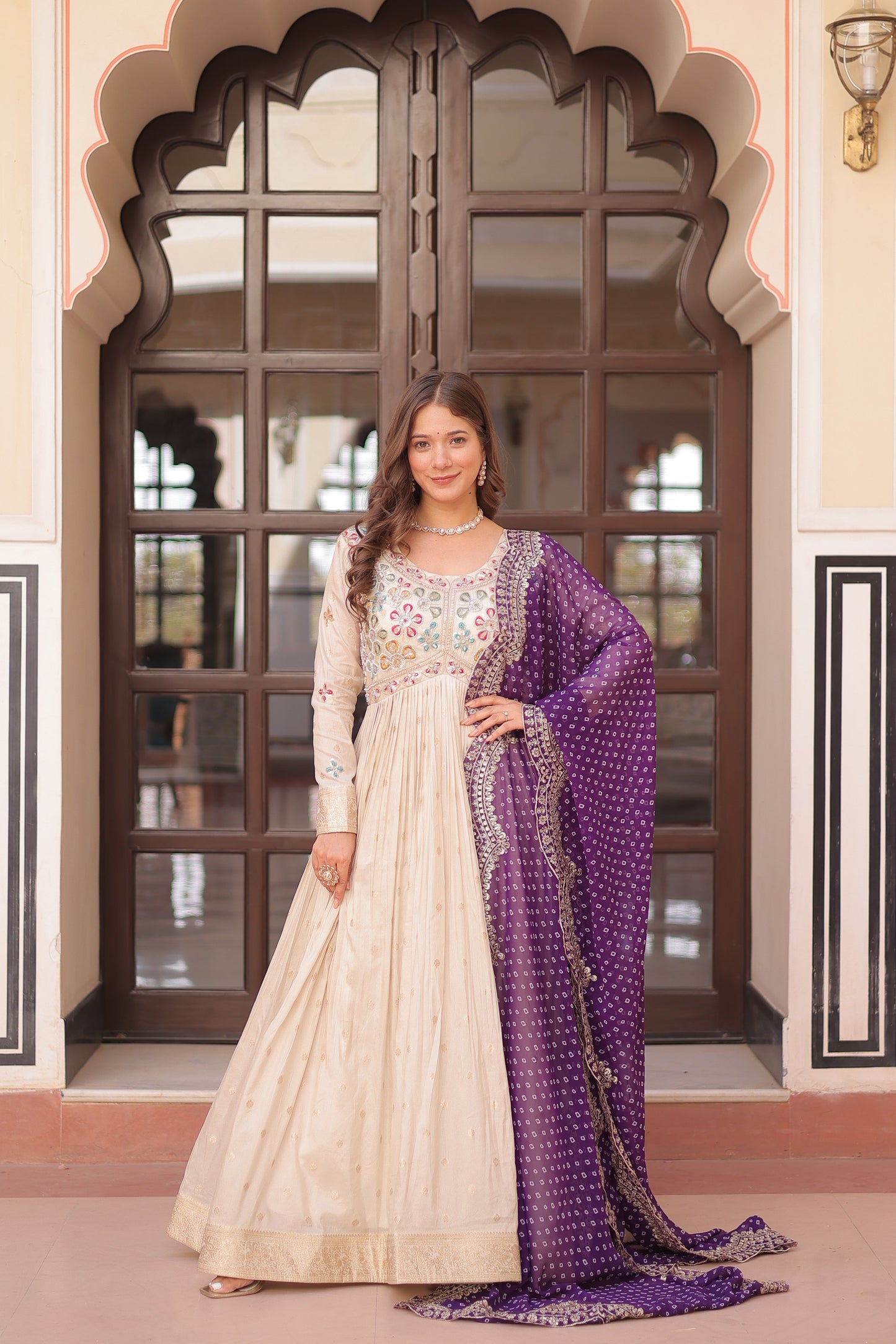 *Experience the allure of Trending Cosmos Jequard Gown With Bandhani Printed Embroidered Cut work Dupatta. Discover the perfect fusion of elegance and grace. Shop now for a timeless appearance.*