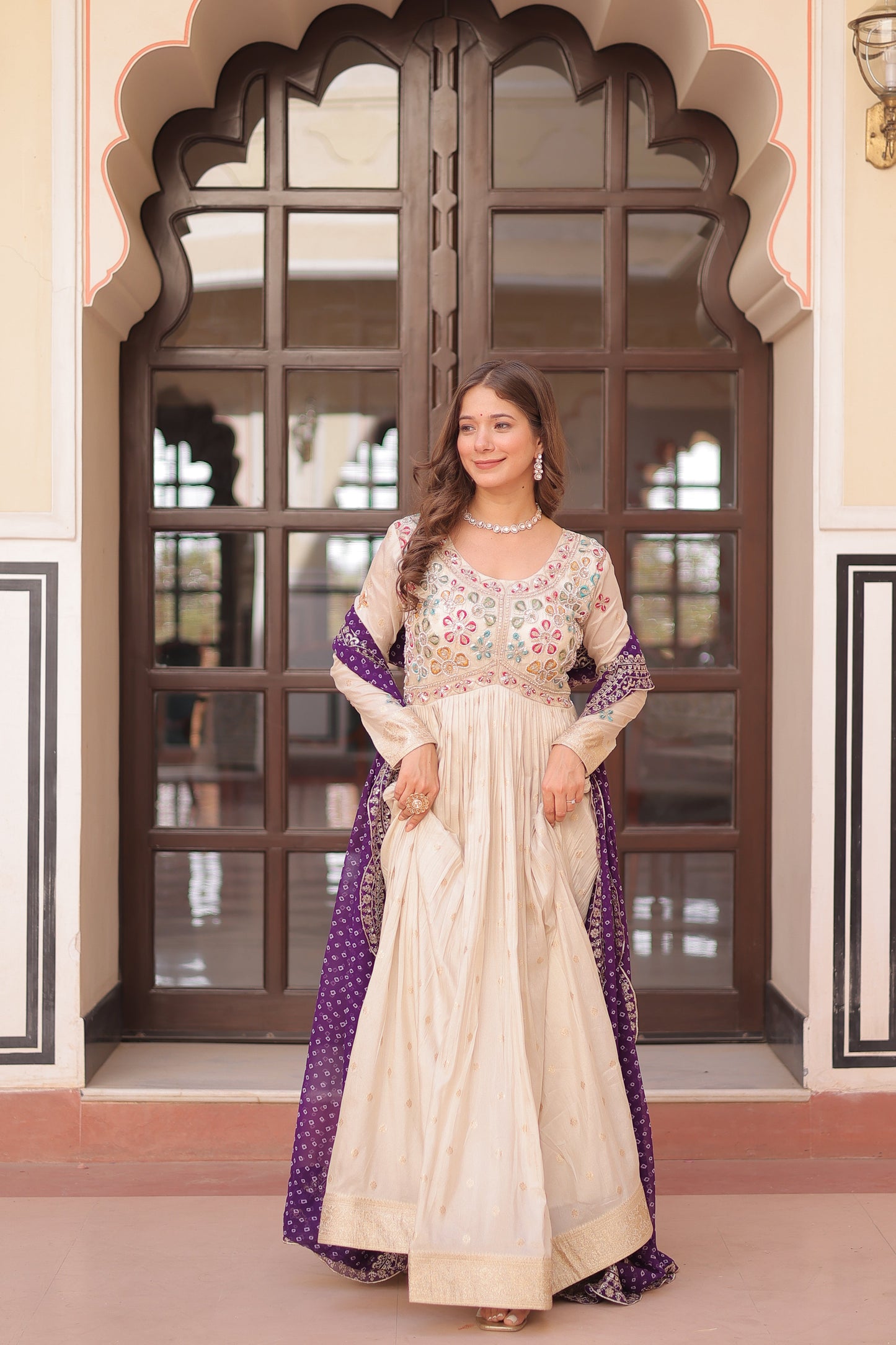 *Experience the allure of Trending Cosmos Jequard Gown With Bandhani Printed Embroidered Cut work Dupatta. Discover the perfect fusion of elegance and grace. Shop now for a timeless appearance.*