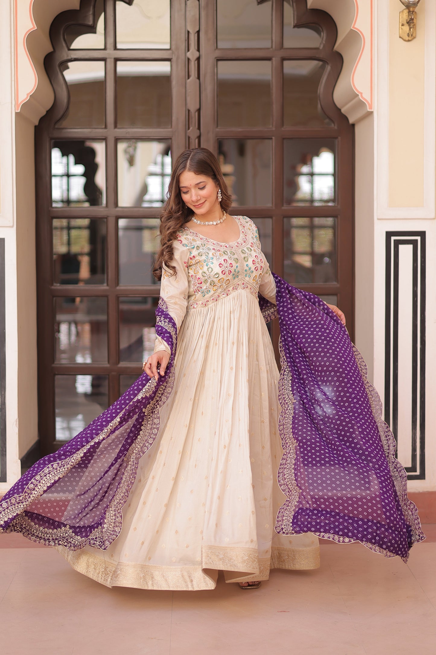 *Experience the allure of Trending Cosmos Jequard Gown With Bandhani Printed Embroidered Cut work Dupatta. Discover the perfect fusion of elegance and grace. Shop now for a timeless appearance.*