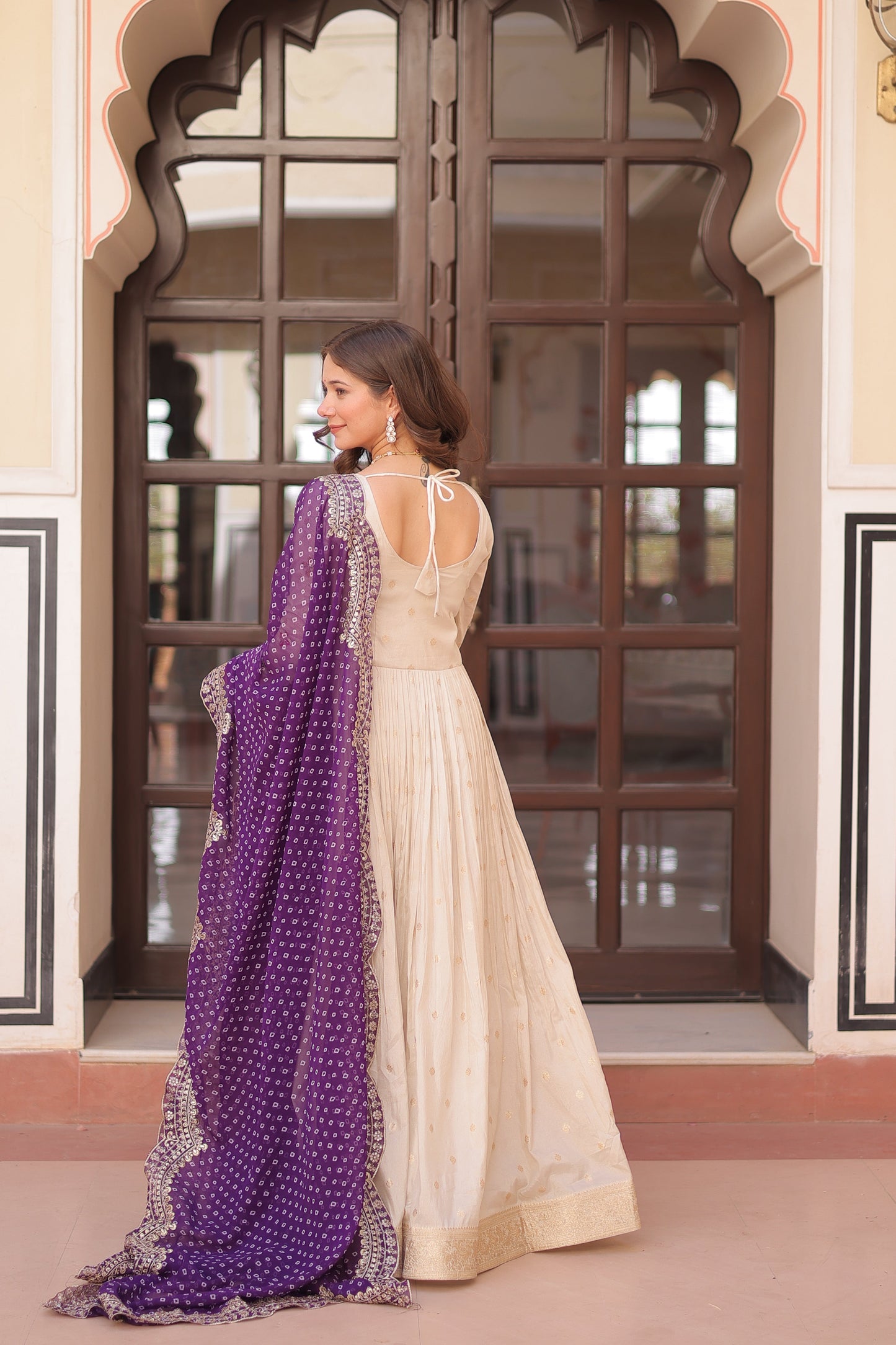 *Experience the allure of Trending Cosmos Jequard Gown With Bandhani Printed Embroidered Cut work Dupatta. Discover the perfect fusion of elegance and grace. Shop now for a timeless appearance.*