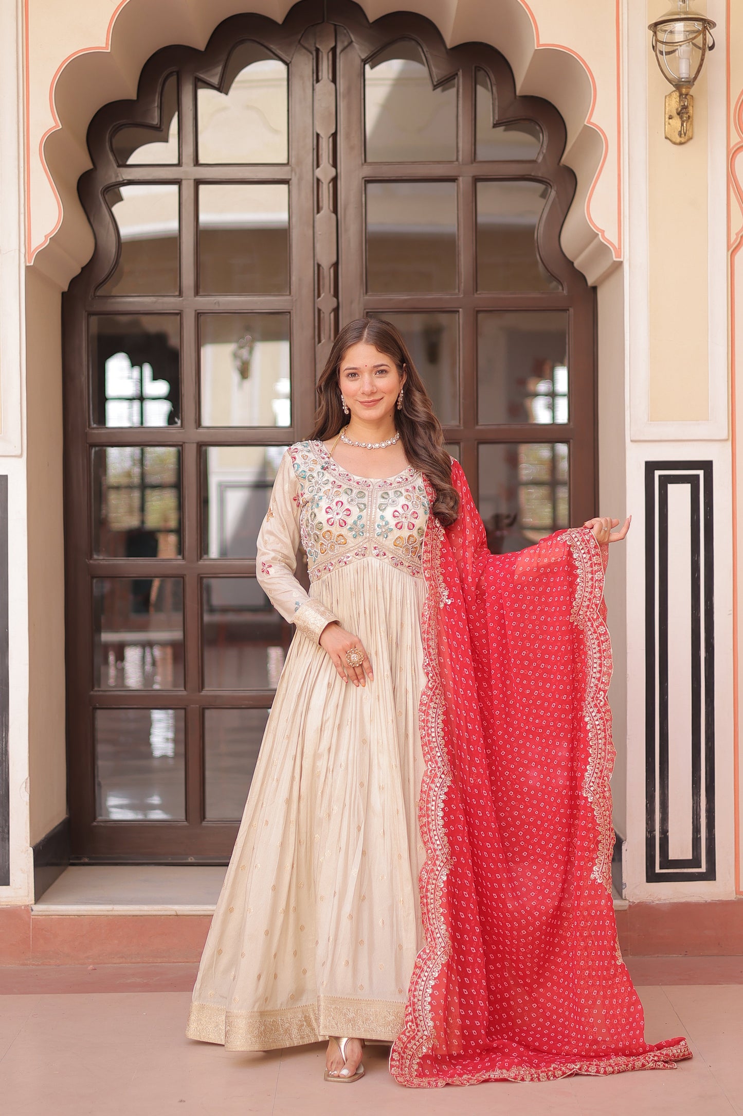 *Experience the allure of Trending Cosmos Jequard Gown With Bandhani Printed Embroidered Cut work Dupatta. Discover the perfect fusion of elegance and grace. Shop now for a timeless appearance.*