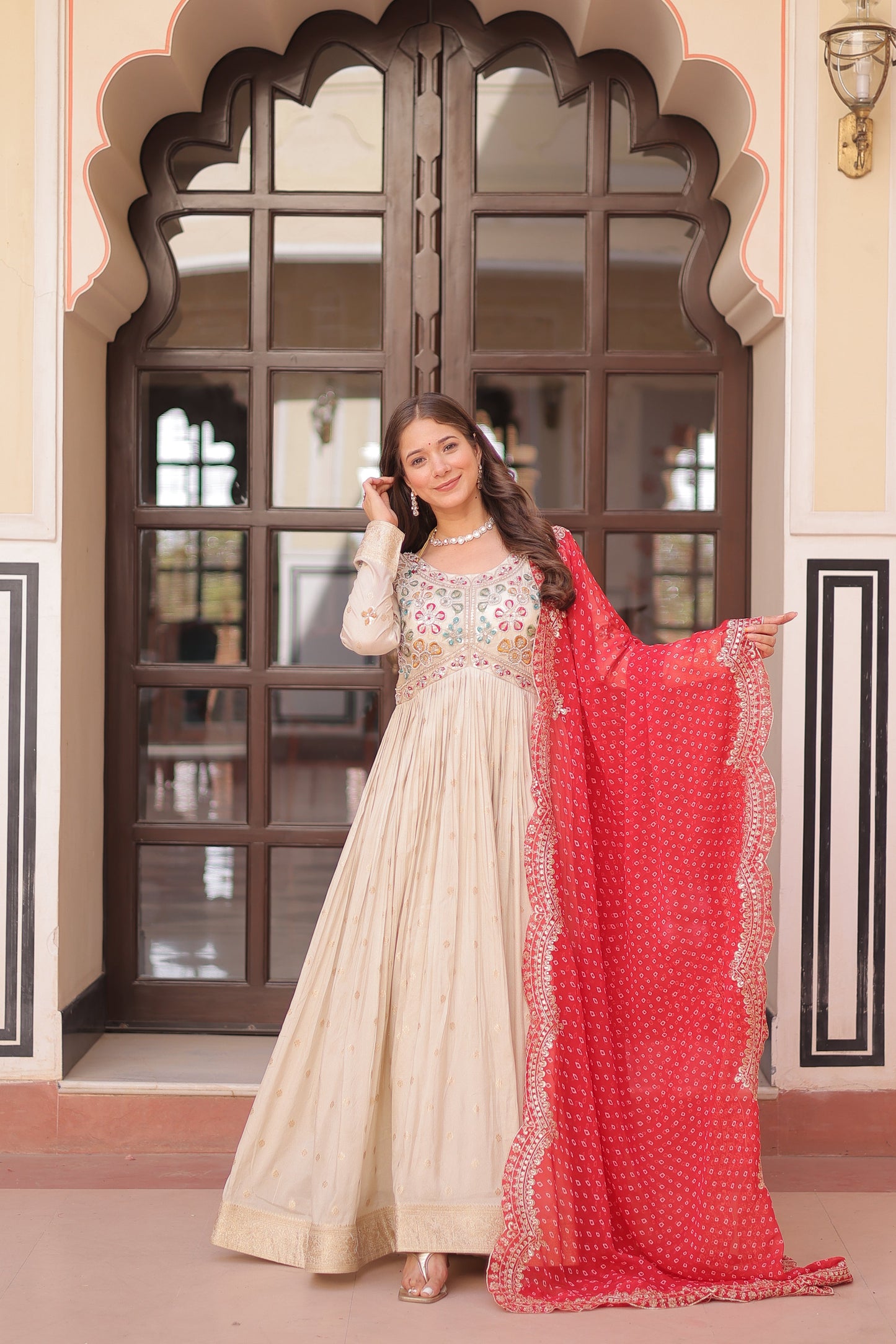 *Experience the allure of Trending Cosmos Jequard Gown With Bandhani Printed Embroidered Cut work Dupatta. Discover the perfect fusion of elegance and grace. Shop now for a timeless appearance.*