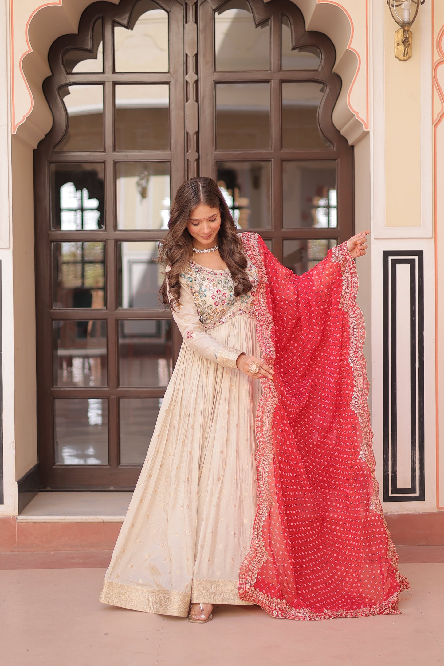 *Experience the allure of Trending Cosmos Jequard Gown With Bandhani Printed Embroidered Cut work Dupatta. Discover the perfect fusion of elegance and grace. Shop now for a timeless appearance.*