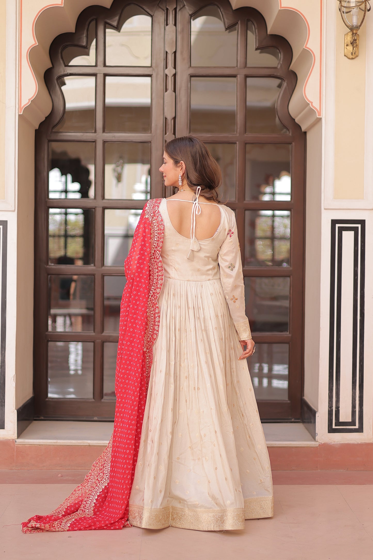 *Experience the allure of Trending Cosmos Jequard Gown With Bandhani Printed Embroidered Cut work Dupatta. Discover the perfect fusion of elegance and grace. Shop now for a timeless appearance.*