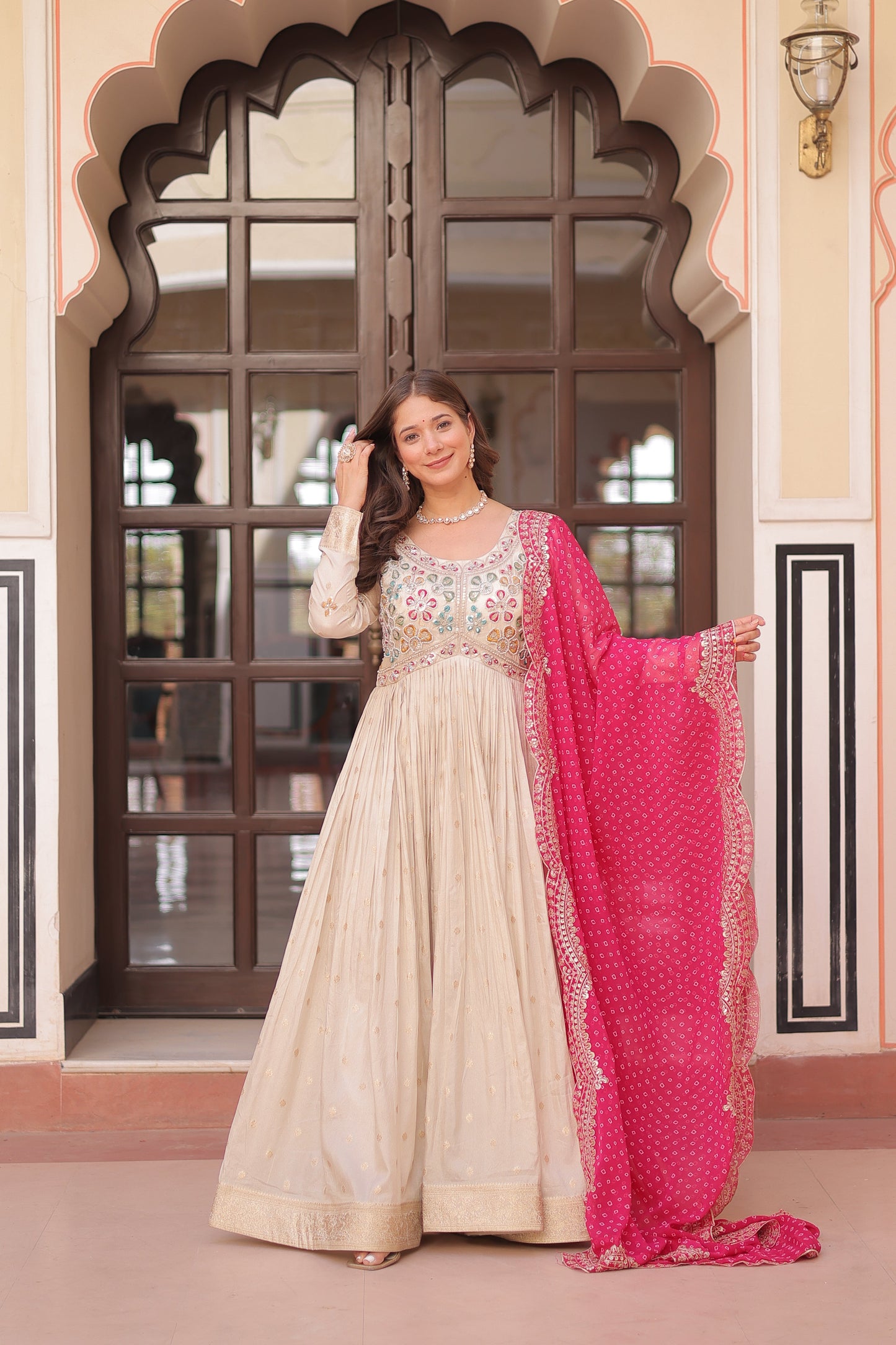 *Experience the allure of Trending Cosmos Jequard Gown With Bandhani Printed Embroidered Cut work Dupatta. Discover the perfect fusion of elegance and grace. Shop now for a timeless appearance.*
